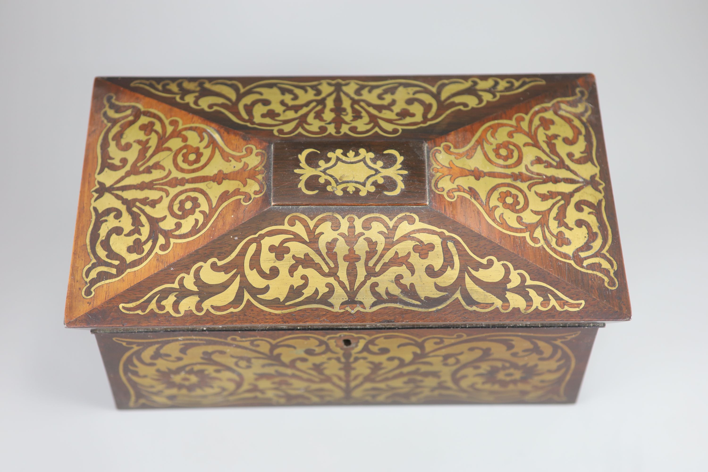 An early 19th century brass inlaid rosewood tea caddy in the boulle manner, 33 x 18cm, 18cm high.
